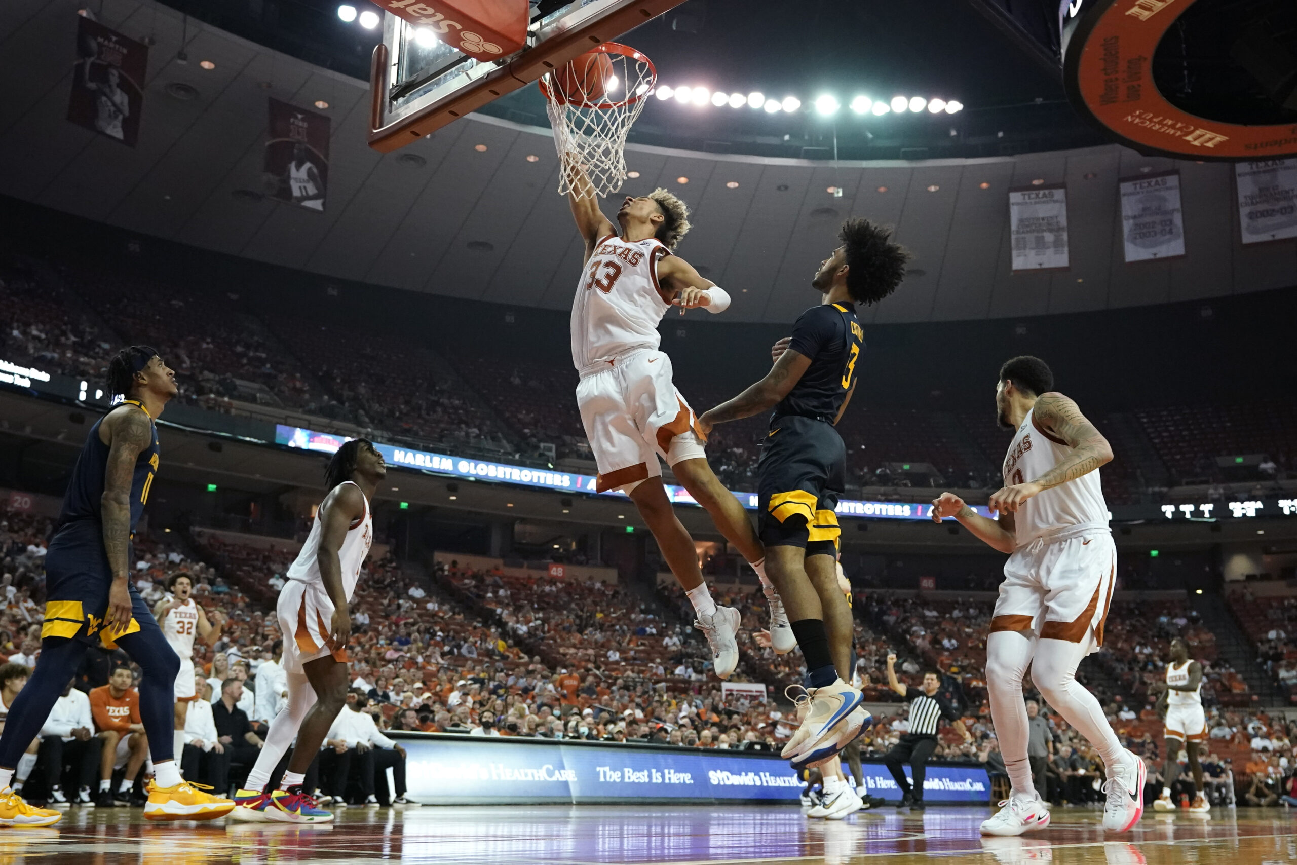 Marcus Carr leads No. 17 Texas past short-handed WVU 74-59